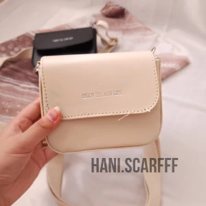 کیف چرم بند کنفی(رنگ شیری)
