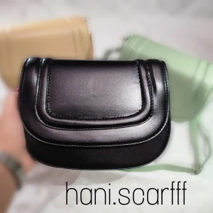 کیف دایره‌ای رنگ مشکی
